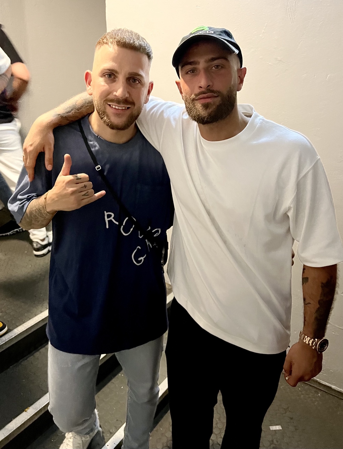 DJ AND-J with an artist after a performance